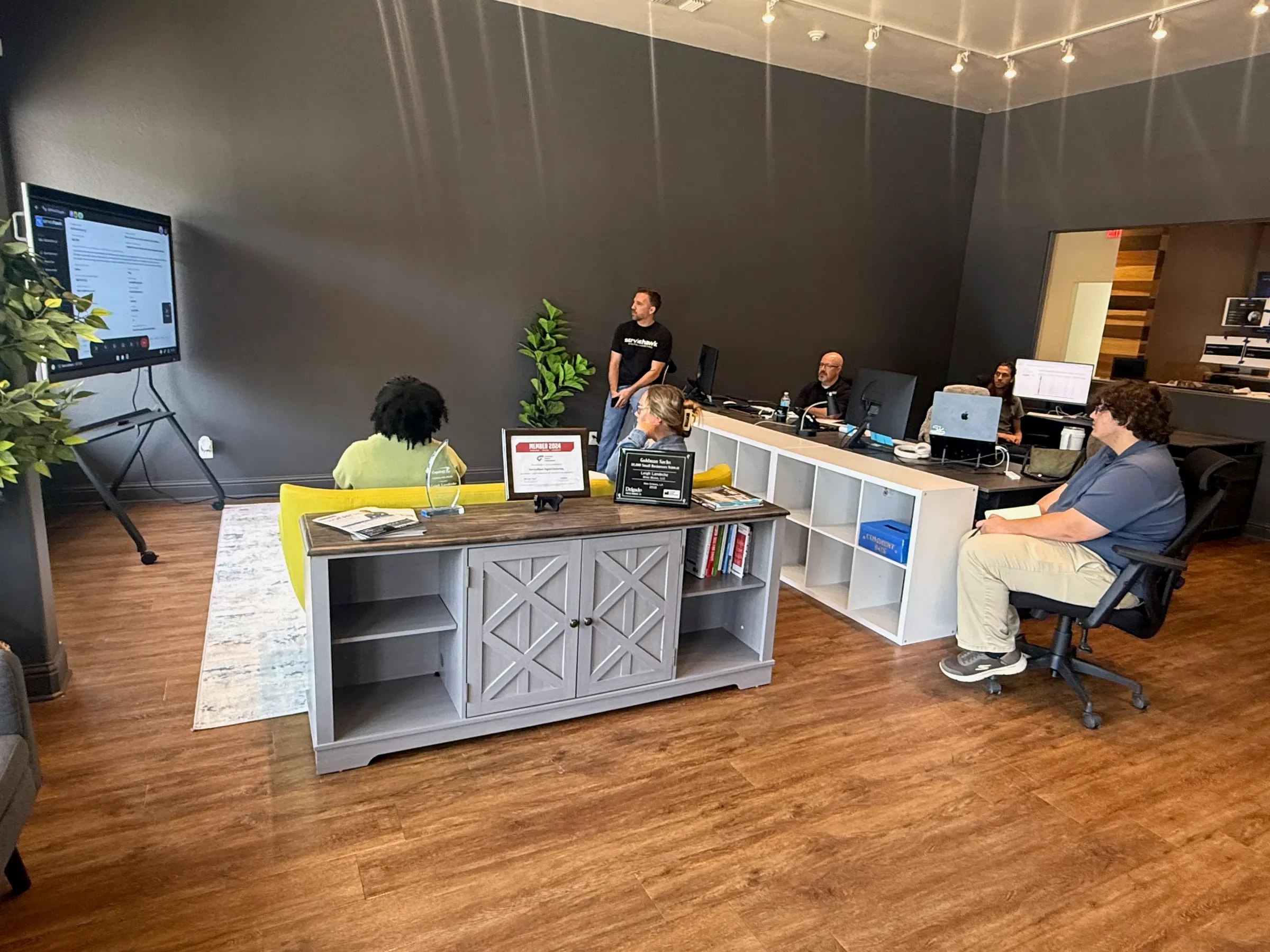 The ServiceHawk team in a strategy meeting at the Madisonville, Louisiana office
